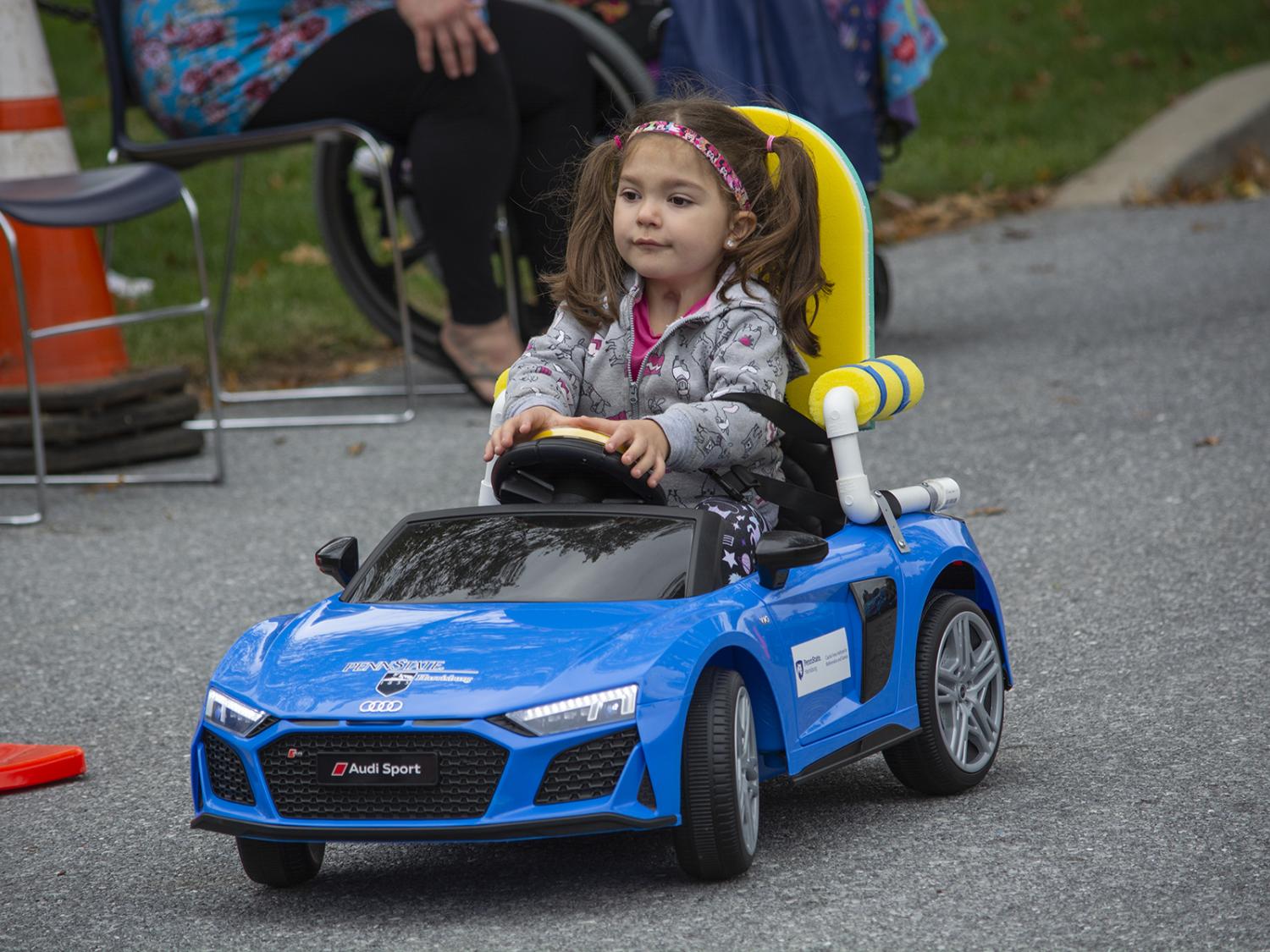 child testing toy car