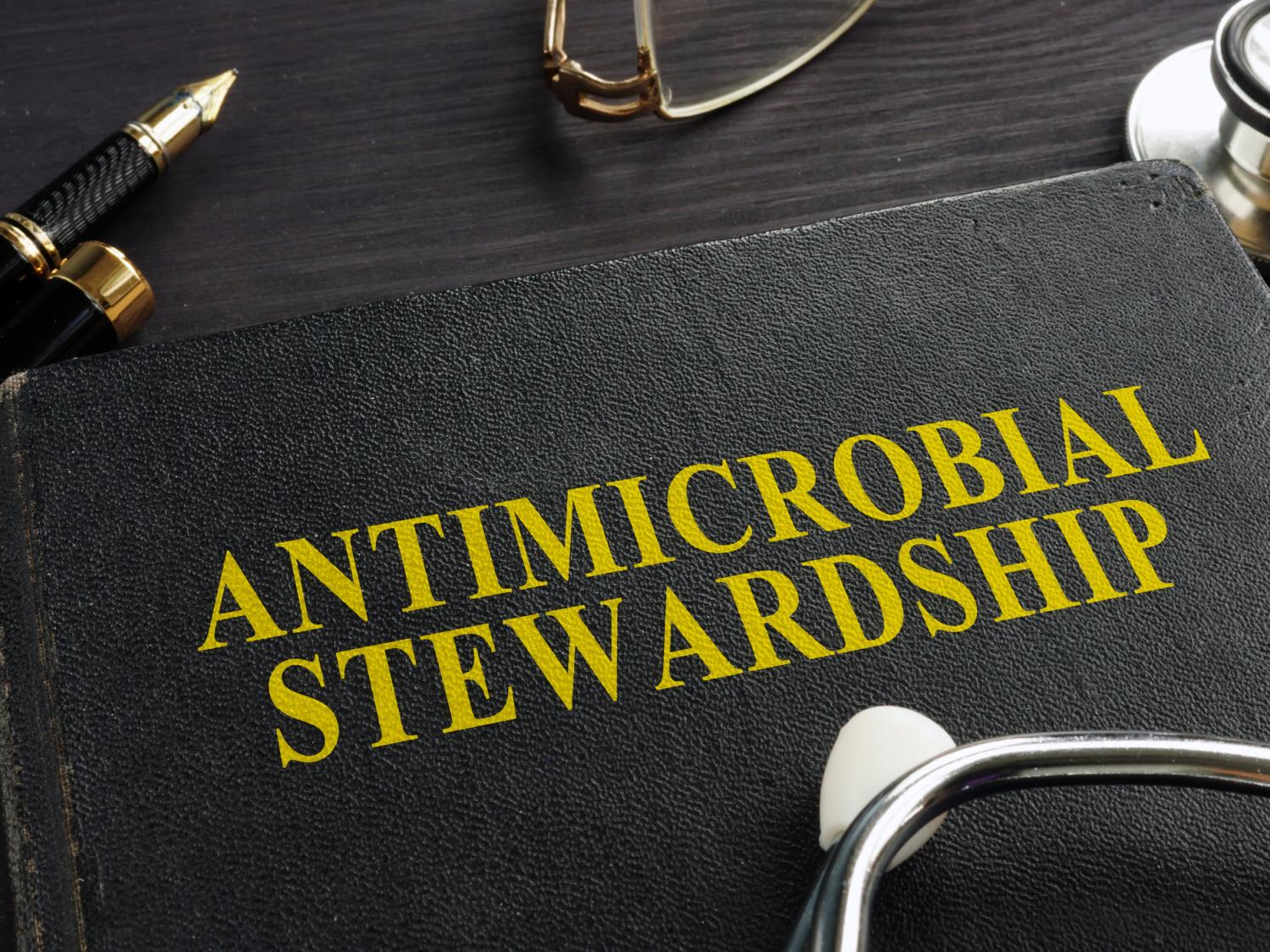 Book with writing that says "Antimicrobial Stewardship"