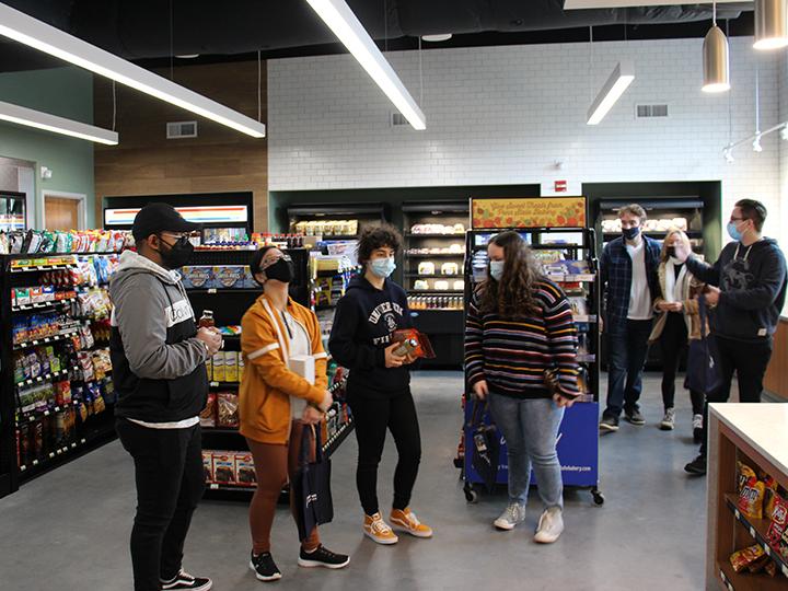 Student inside the newly open Creekside Market at Penn State Berks.