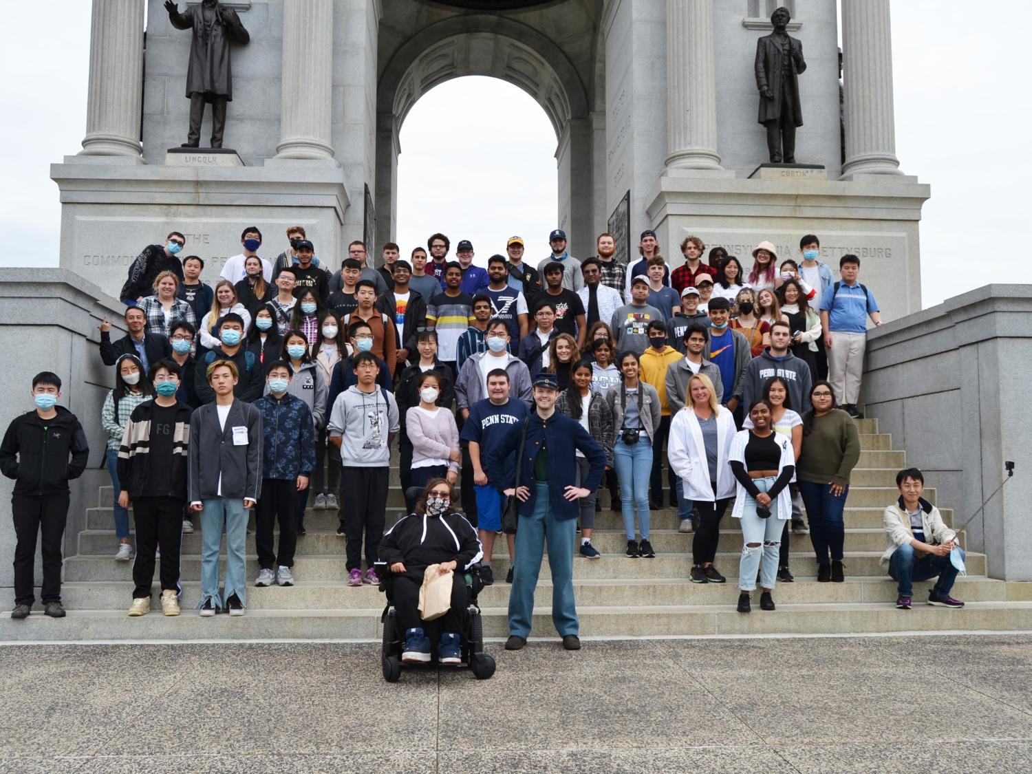 A large group of students standing on steps in front of the Pennsylvania Memorial