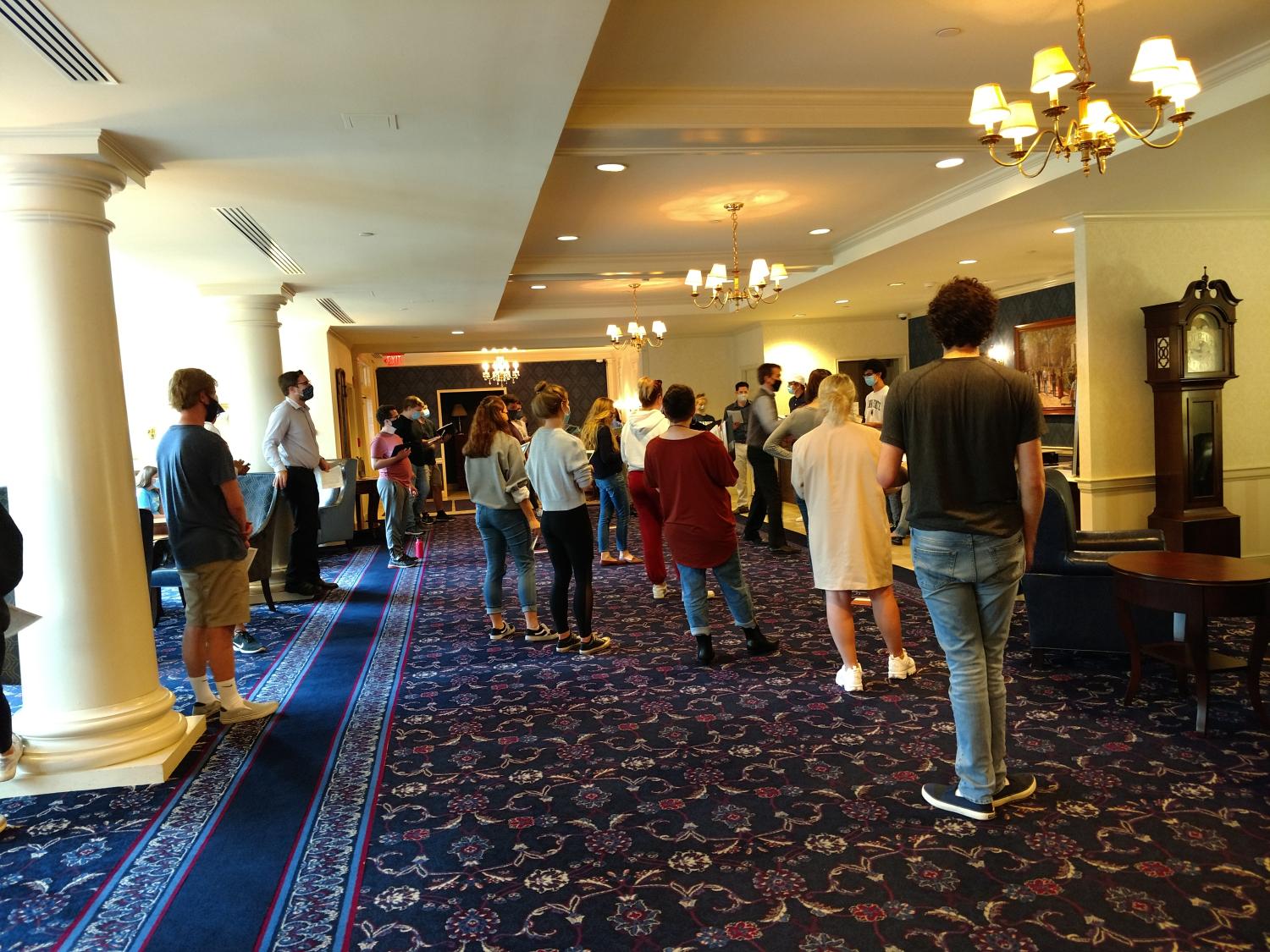 Concert Choir members rehearsing at the Nittany Lion Inn