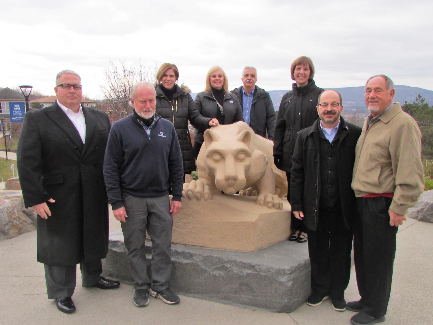 donors and penn state scranton administrators for the new grant posing for a photo at the campus lion shrine