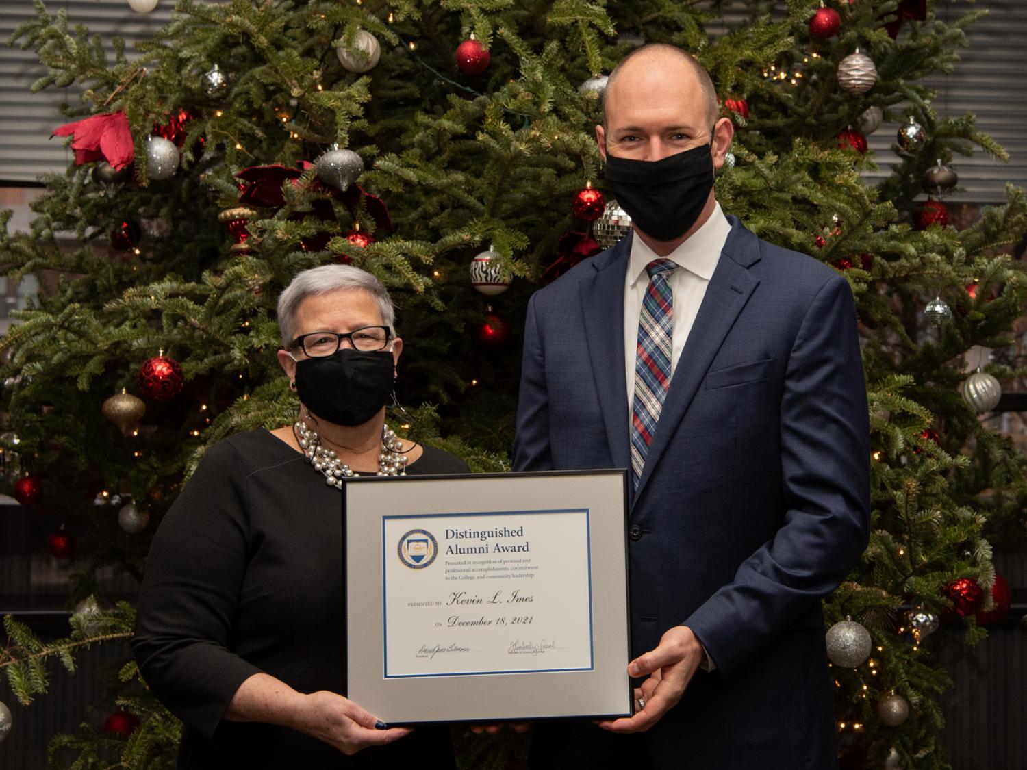 President Davie Jane Gilmour and Kevin Imes standing together