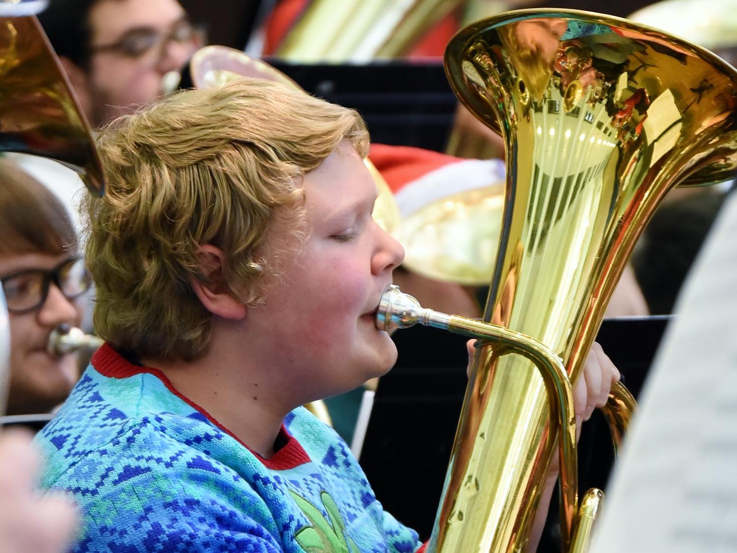 A tuba player performs during a Christmas concert at Penn State Behrend.