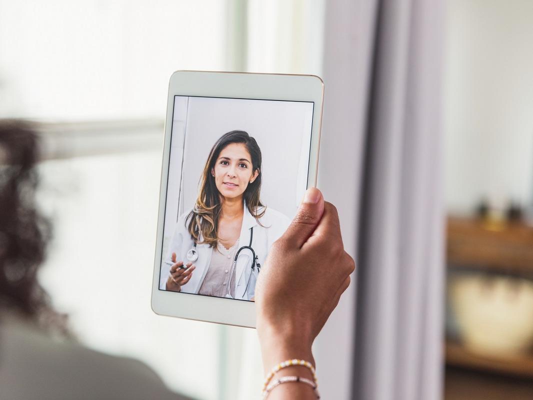 A female doctor a female patient advice during a telemedicine appointment.
