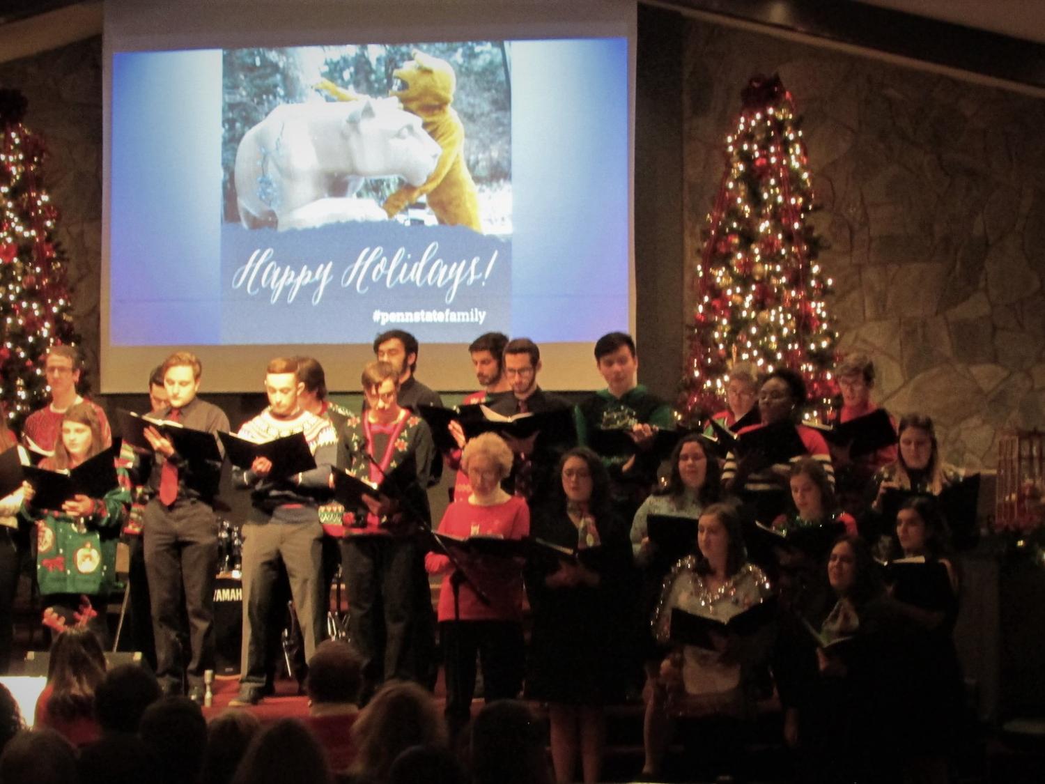 singers from the Scranton chorale dressed in holiday garb singing during the 2019 holiday concert