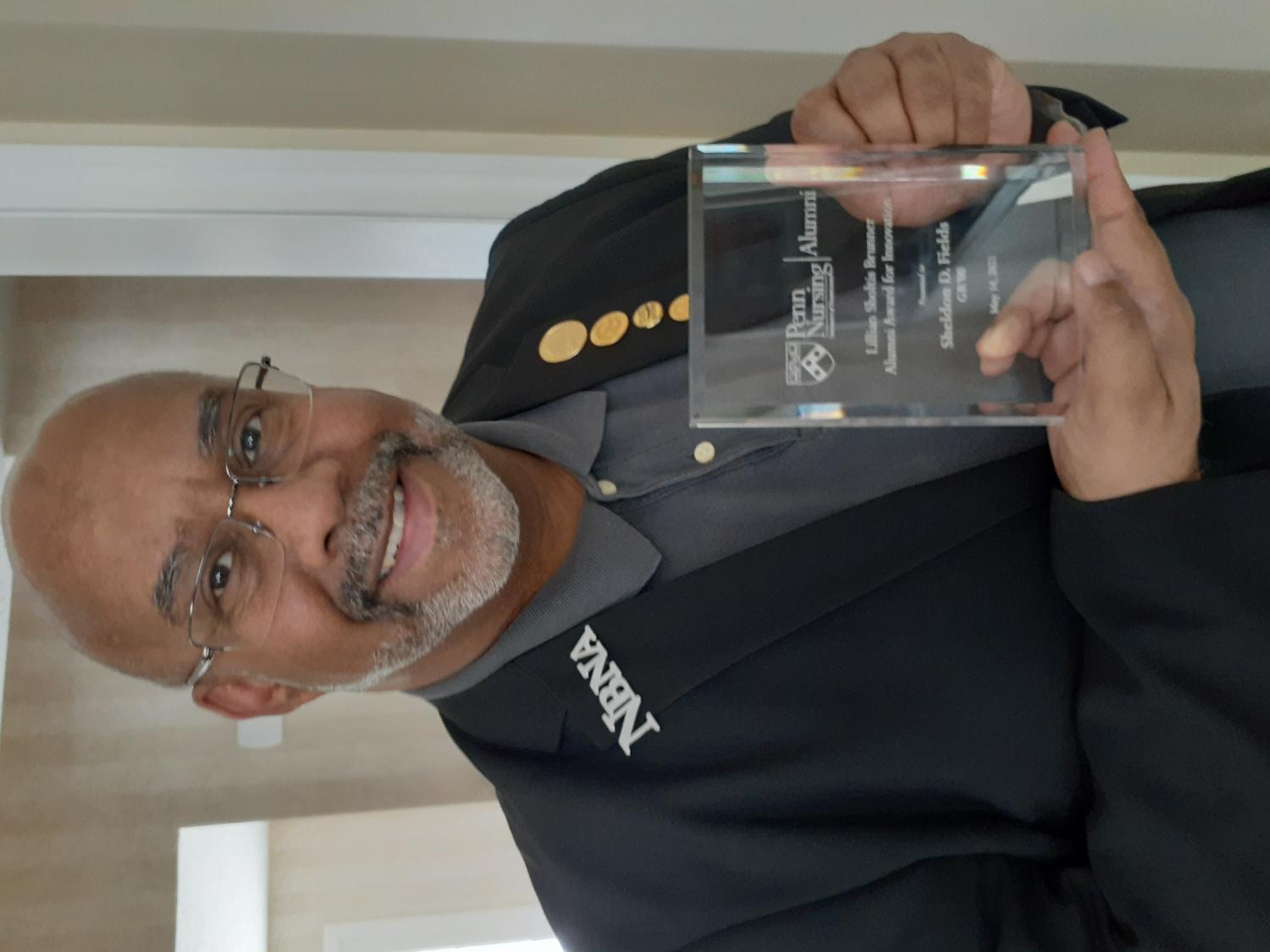 Sheldon Fields with award