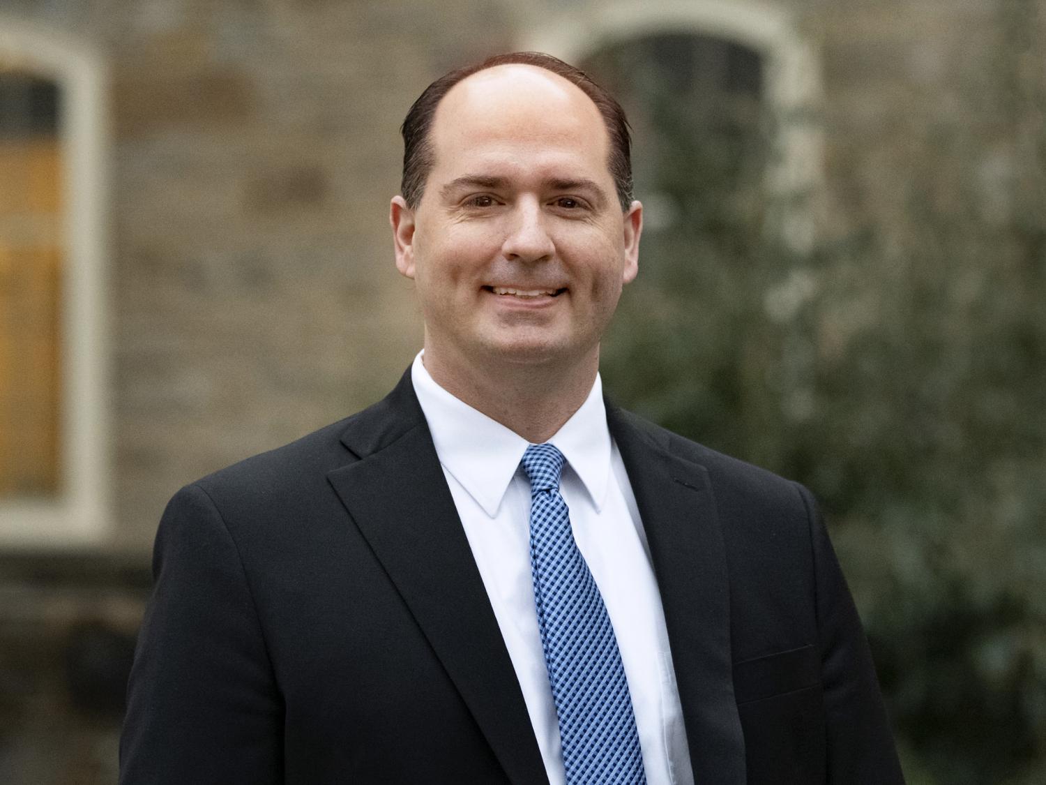 Headshot photo of Kelly Austin outside Old Main