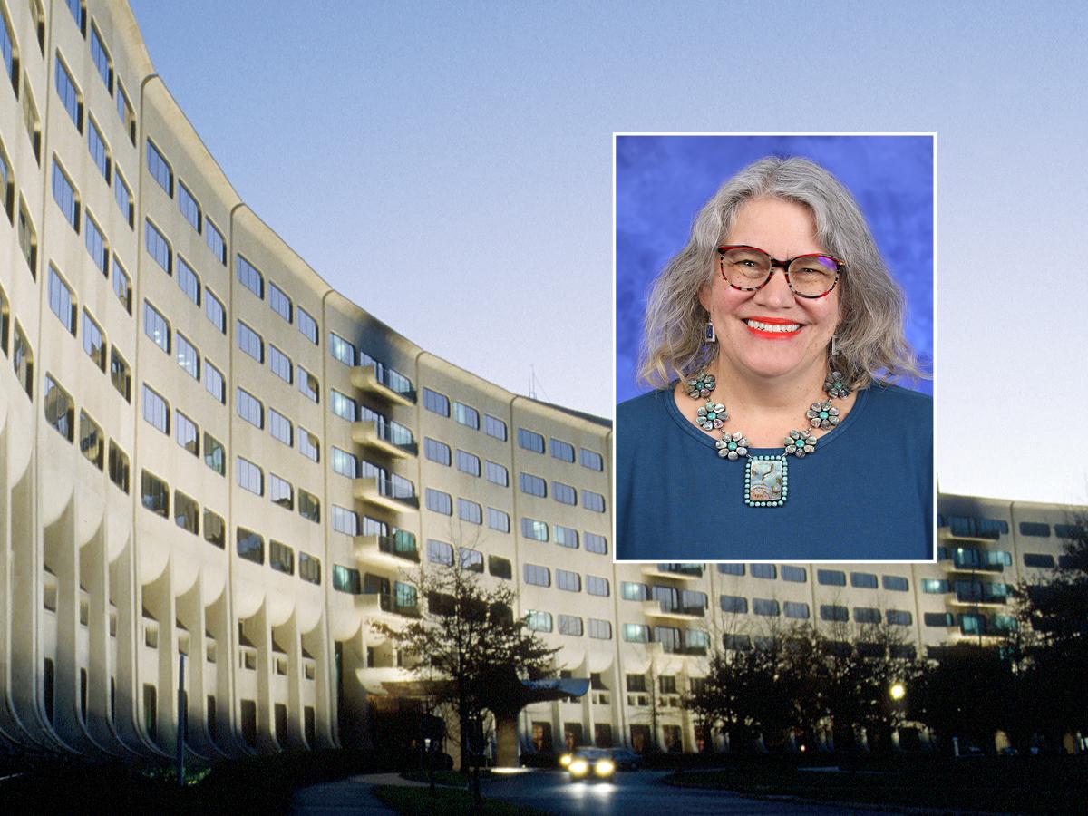 A head and shoulders professional portrait of Dr. Martha Levine against a background image of Penn State College of Medicine.