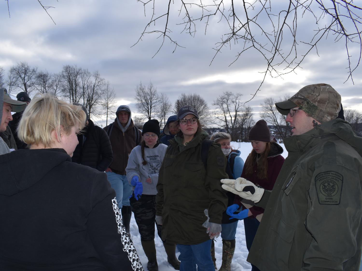 Pennsylvania State Game Warden Thomas Henry led students in a simulated investigation of the illegal killing of a deer.  
