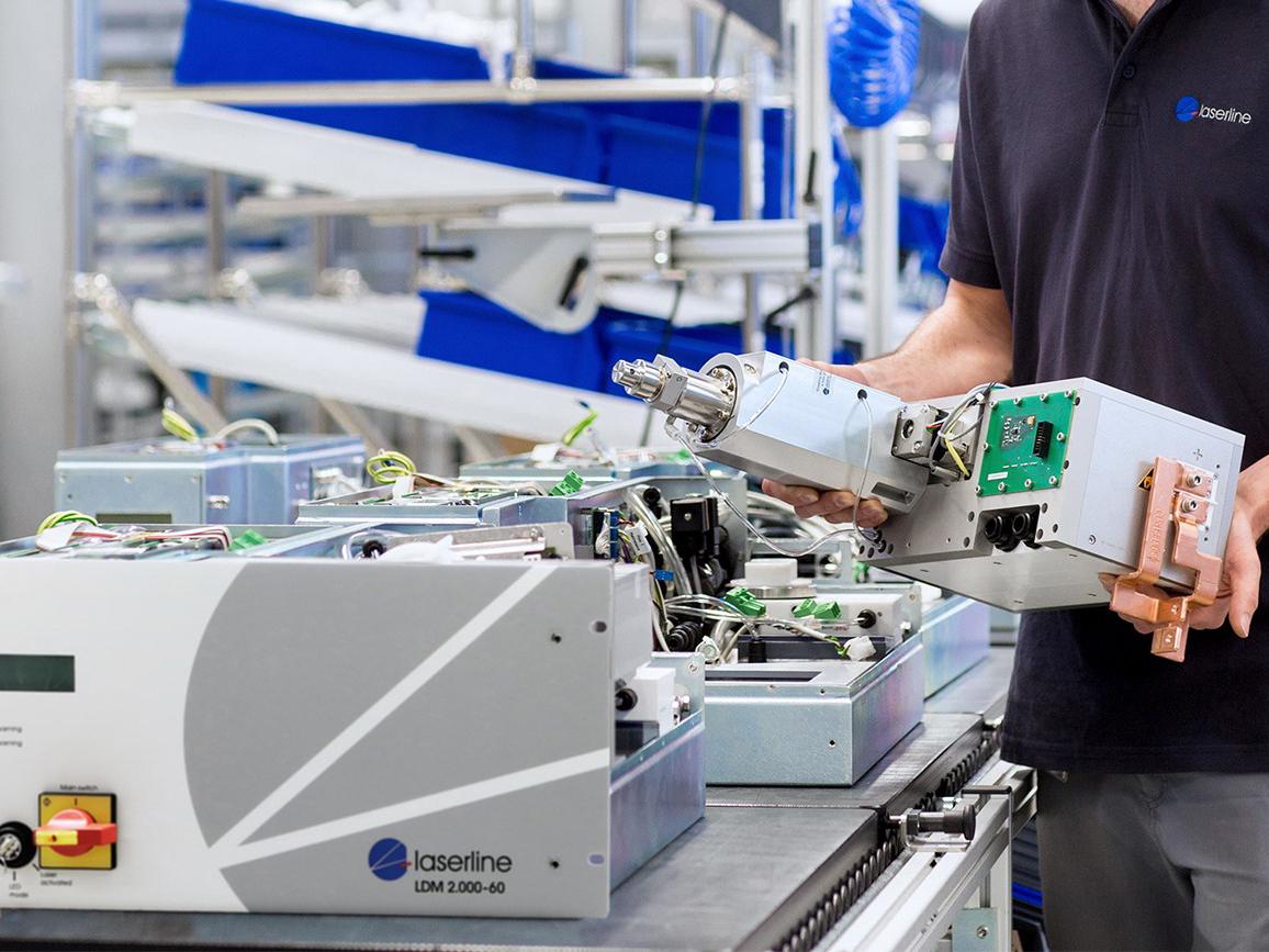 a person working with laser equipment in a lab
