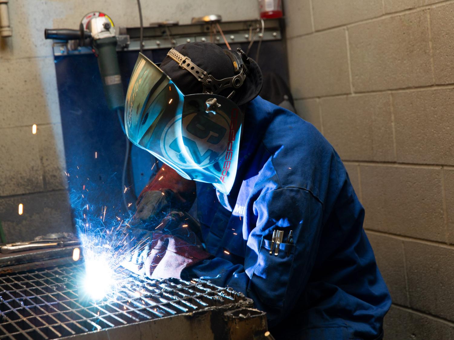 A person using welding equipment