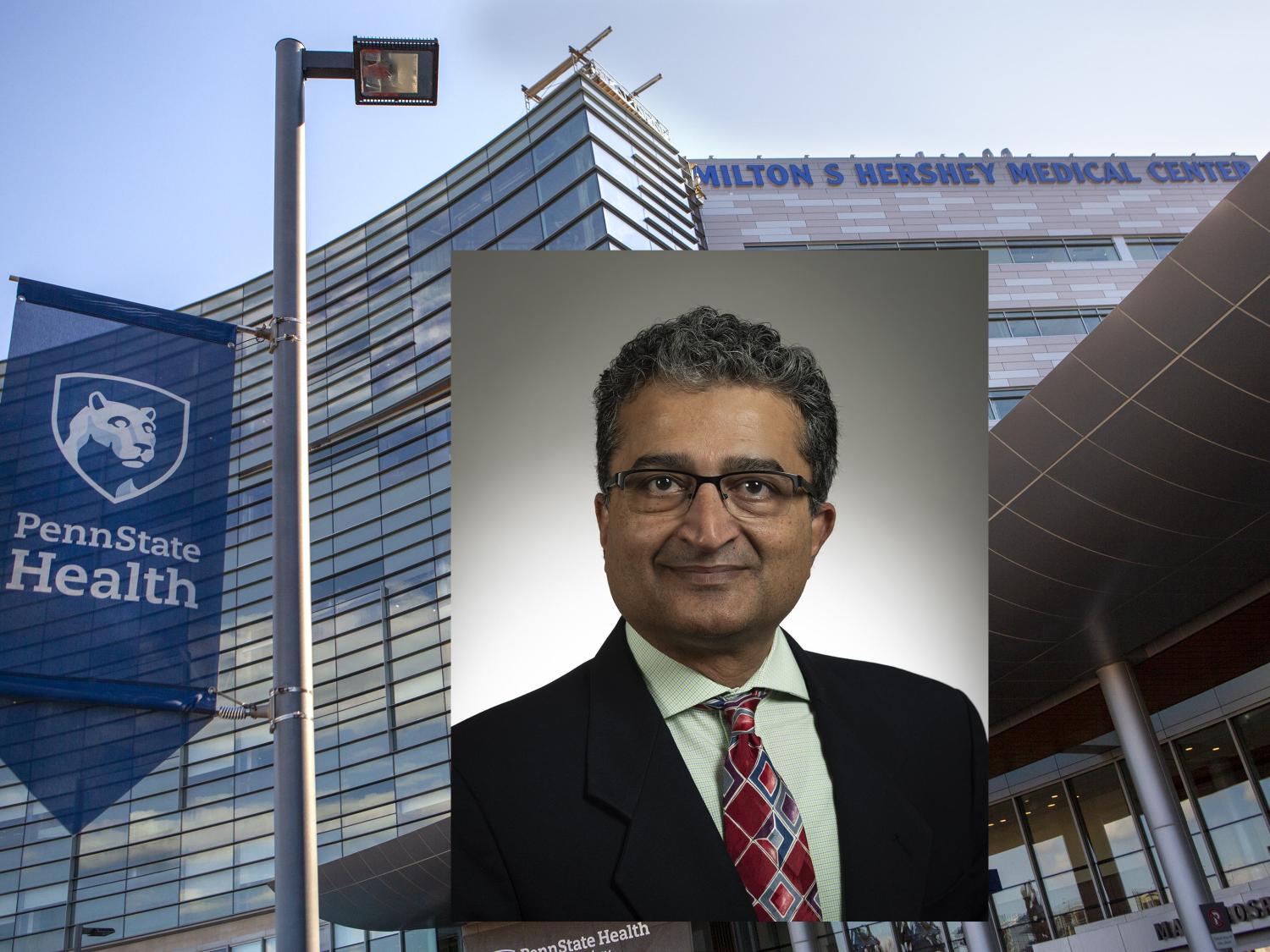 A headshot photo of Dr. Thiru Annaswamy is placed over a stock photo of Hershey Medical Center.