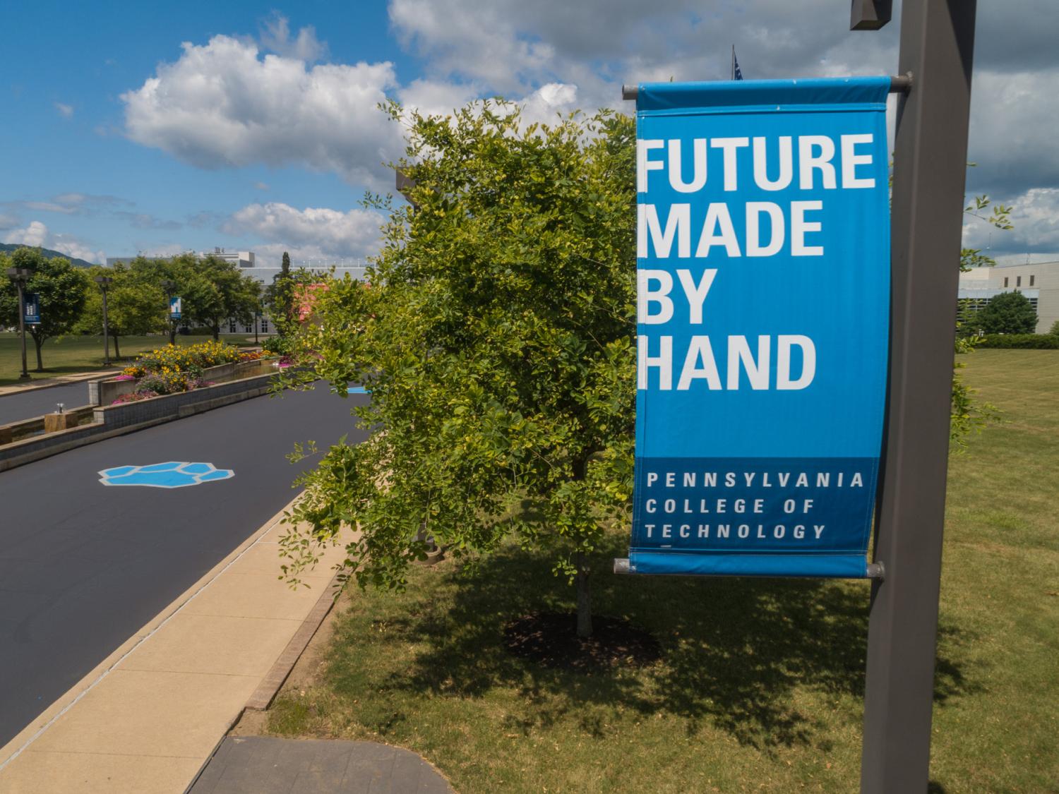 A turquoise blue banner that reads Future Made by Hand