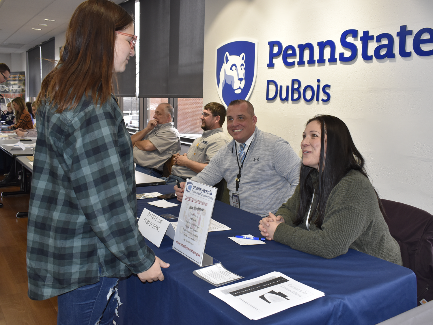 Student talks with employers at career event