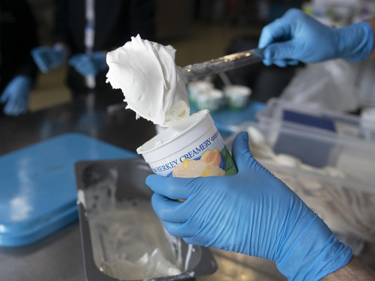 scooping ice cream into a Creamery cup