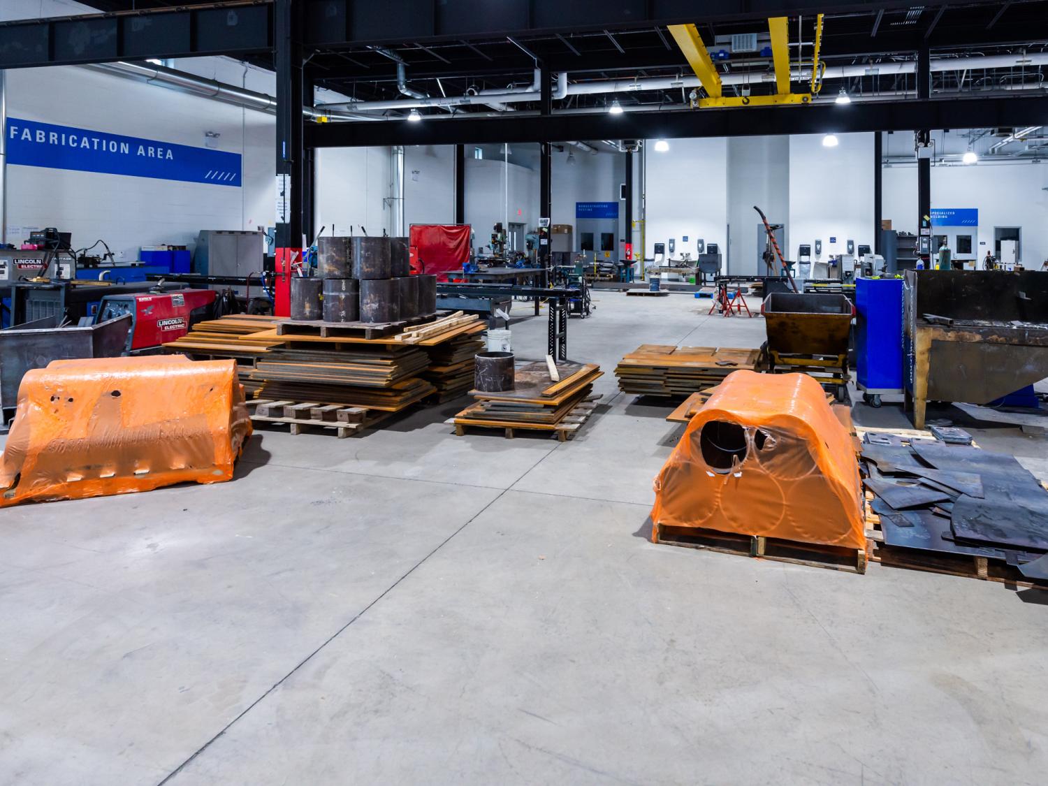  A warehouse interior with equipment inside.