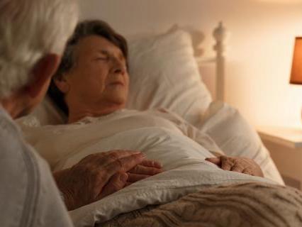 Older couple holding hands