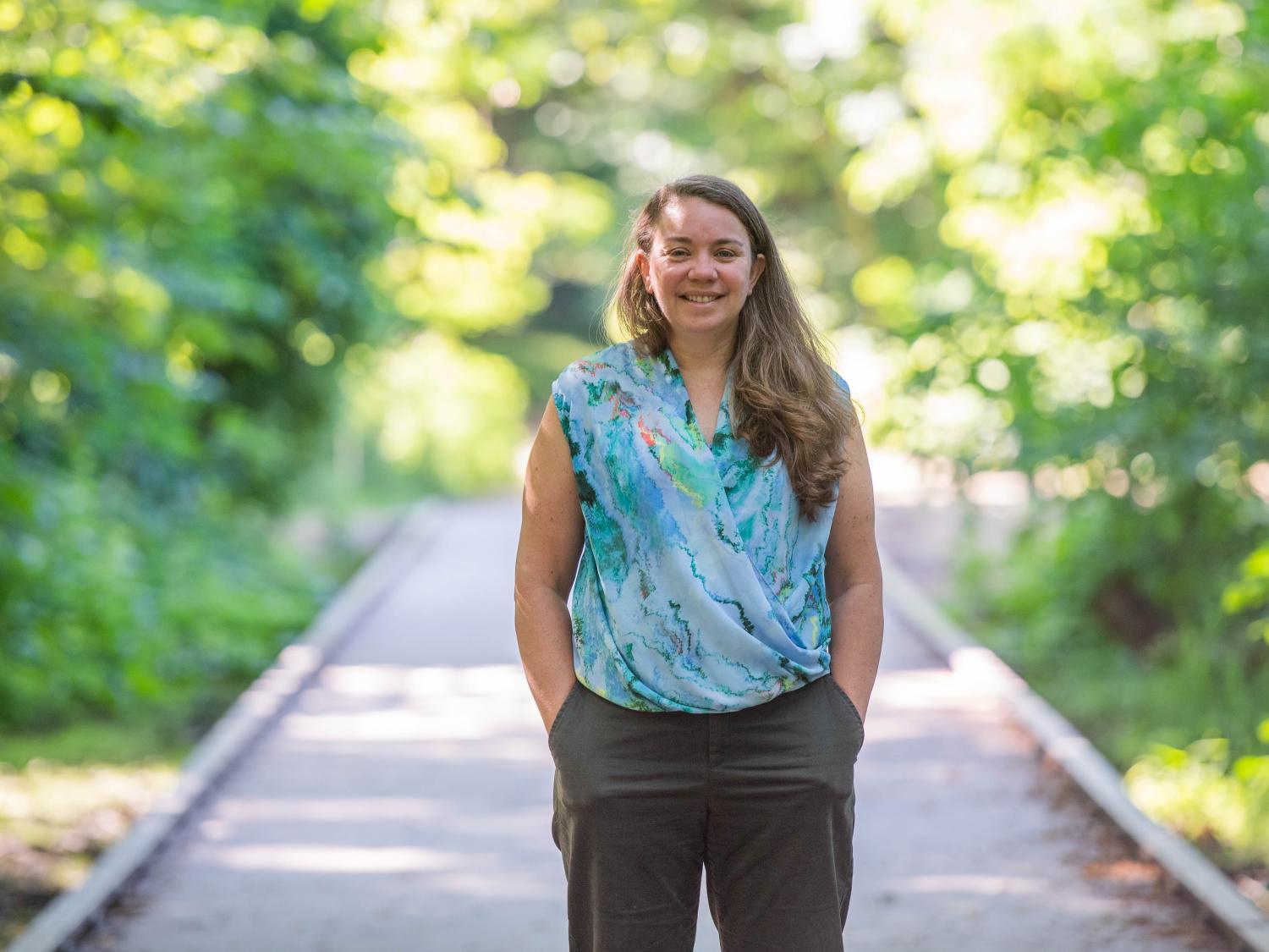 Sam Mason, director of sustainability at Penn State Behrend, poses on a boardwalk in Wintergreen Gorge.