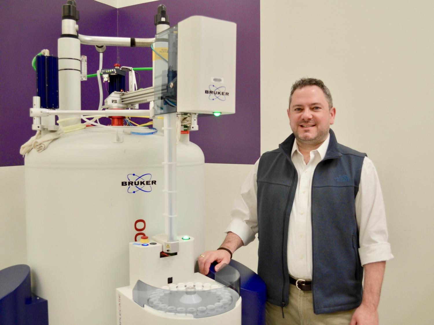 Scott Showalter in front of lab equipment