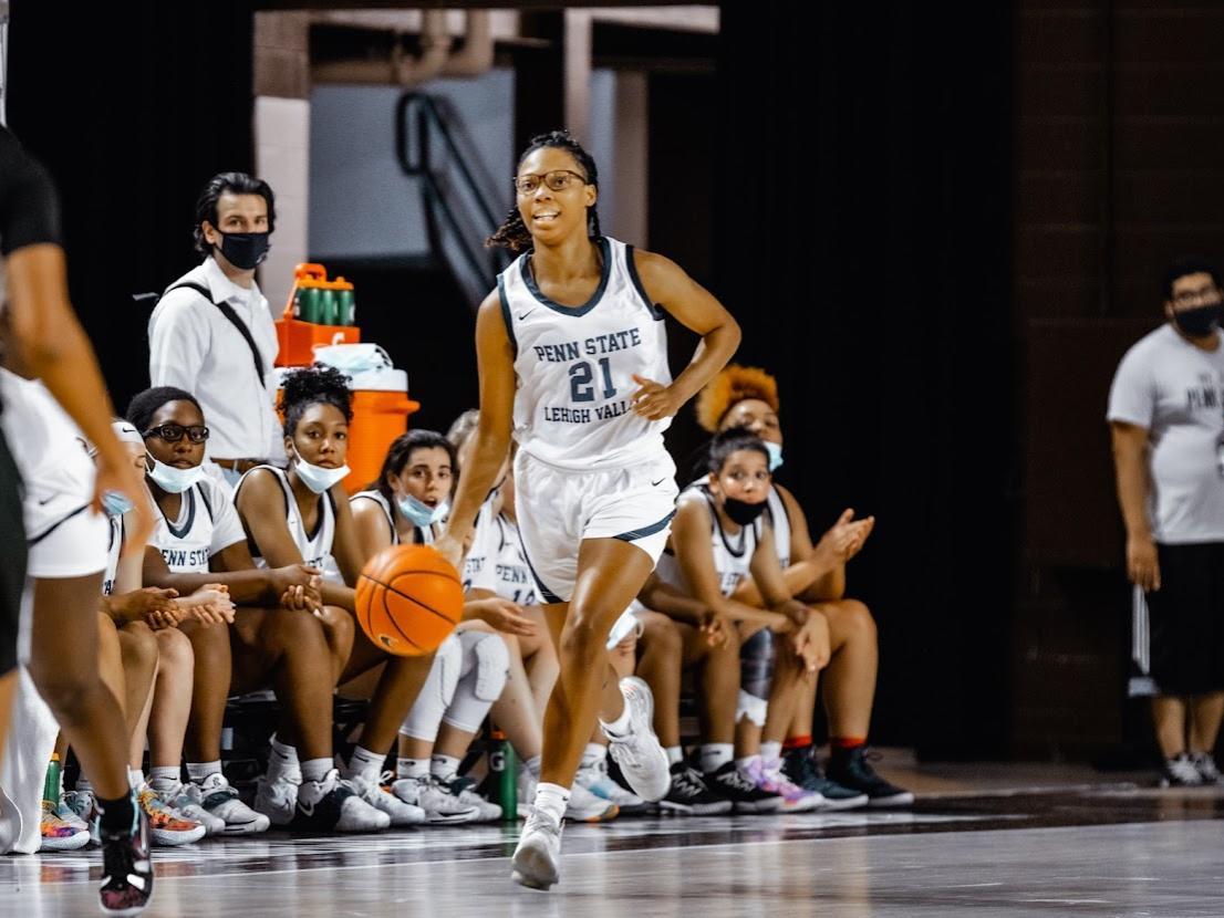 Taylor Rae Styles dribbles down the basketball court. 