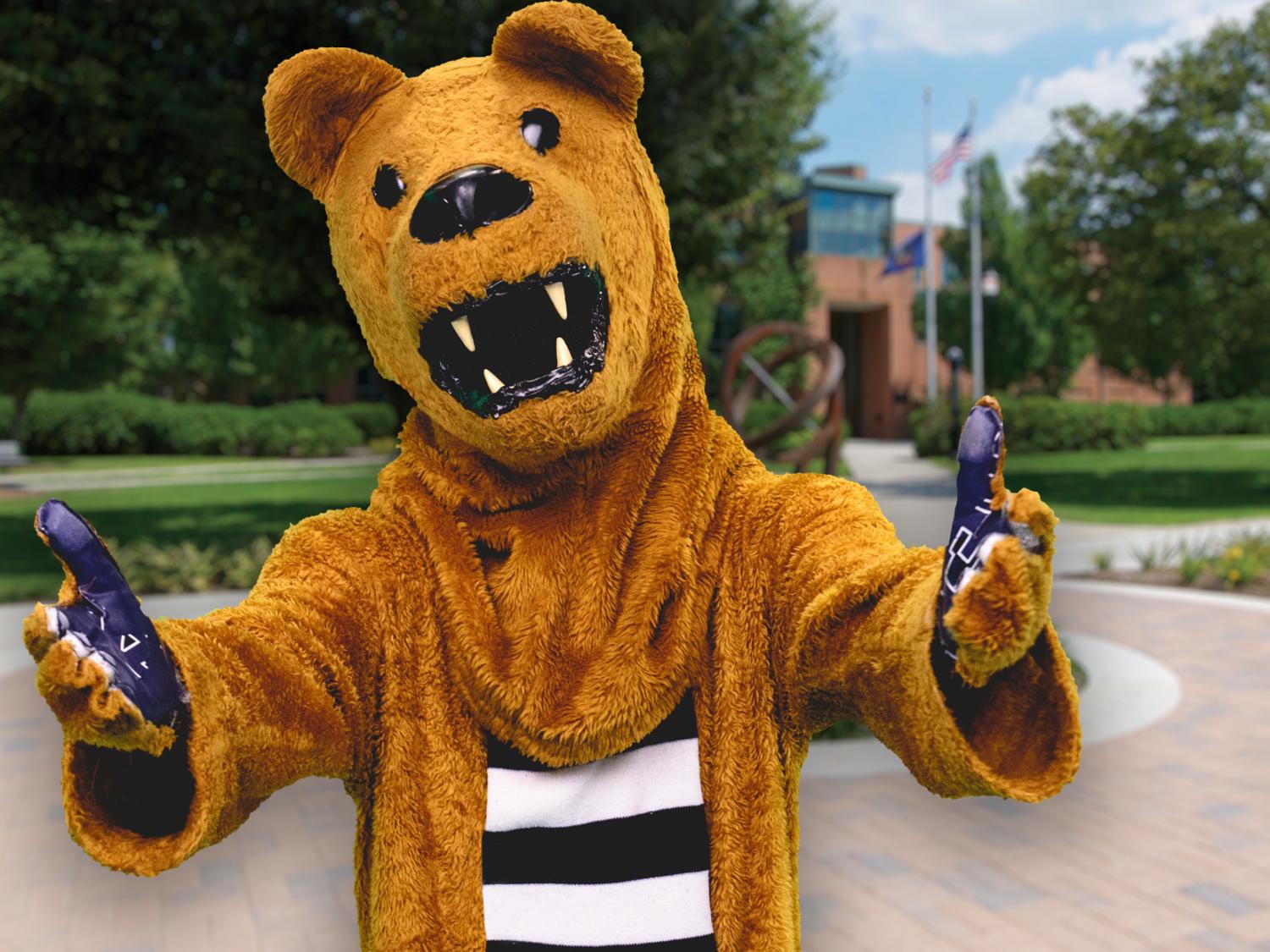 Lion with outstretched arms on campus
