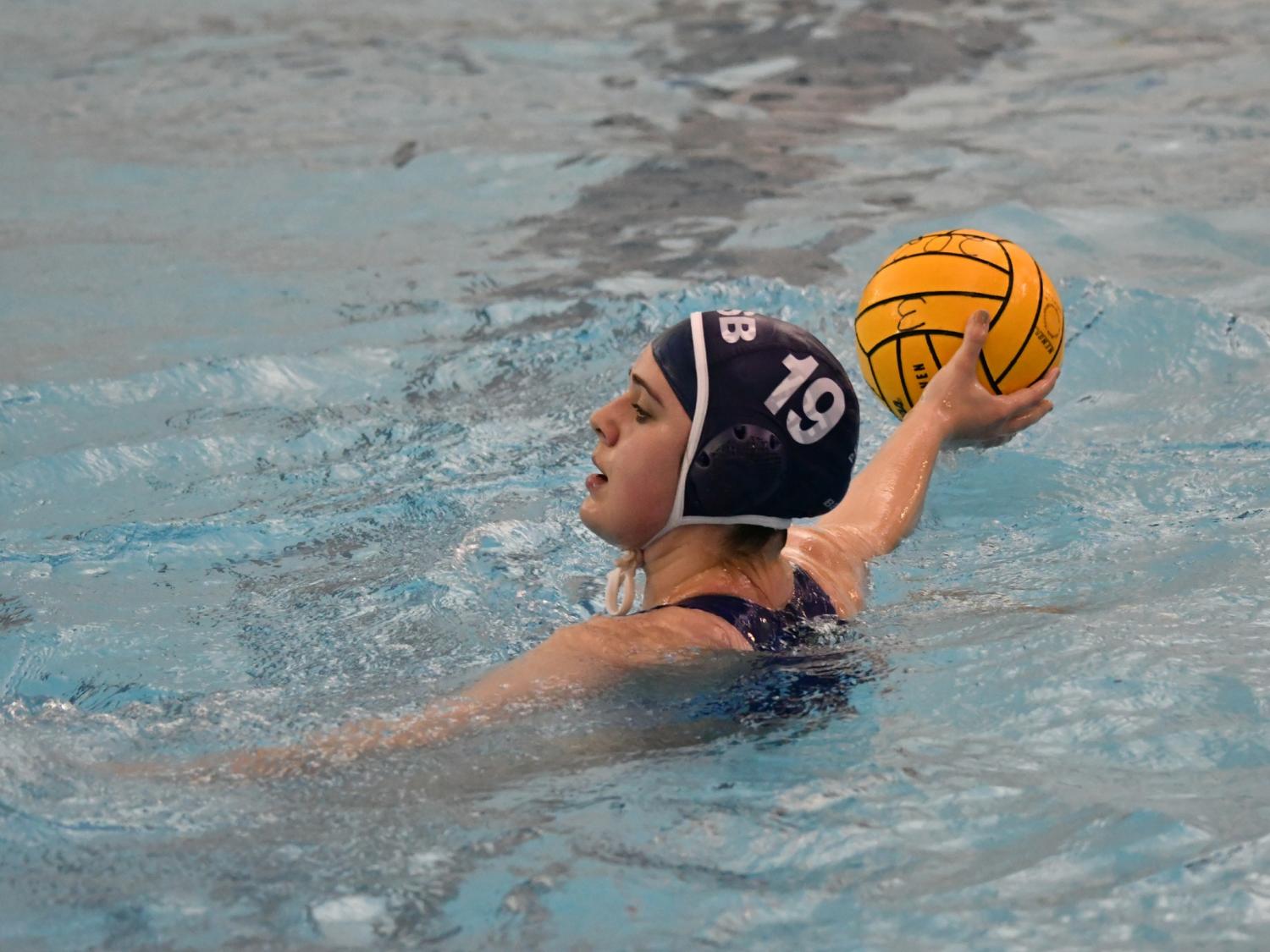 A Penn State Behrend water polo player prepares to throw the ball.