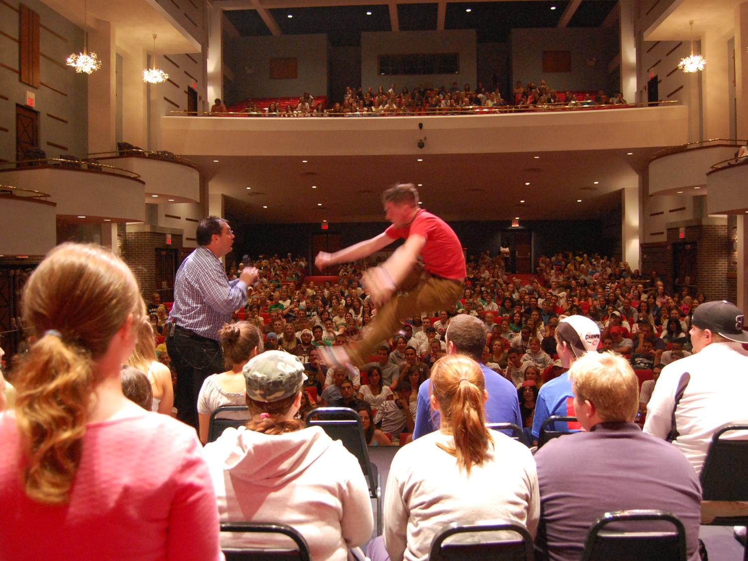 Hypnotist Keith Karkut hypnotizes a student during a performance