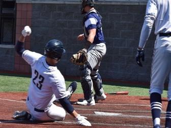 DuBois baseball player sliding into home to score a run