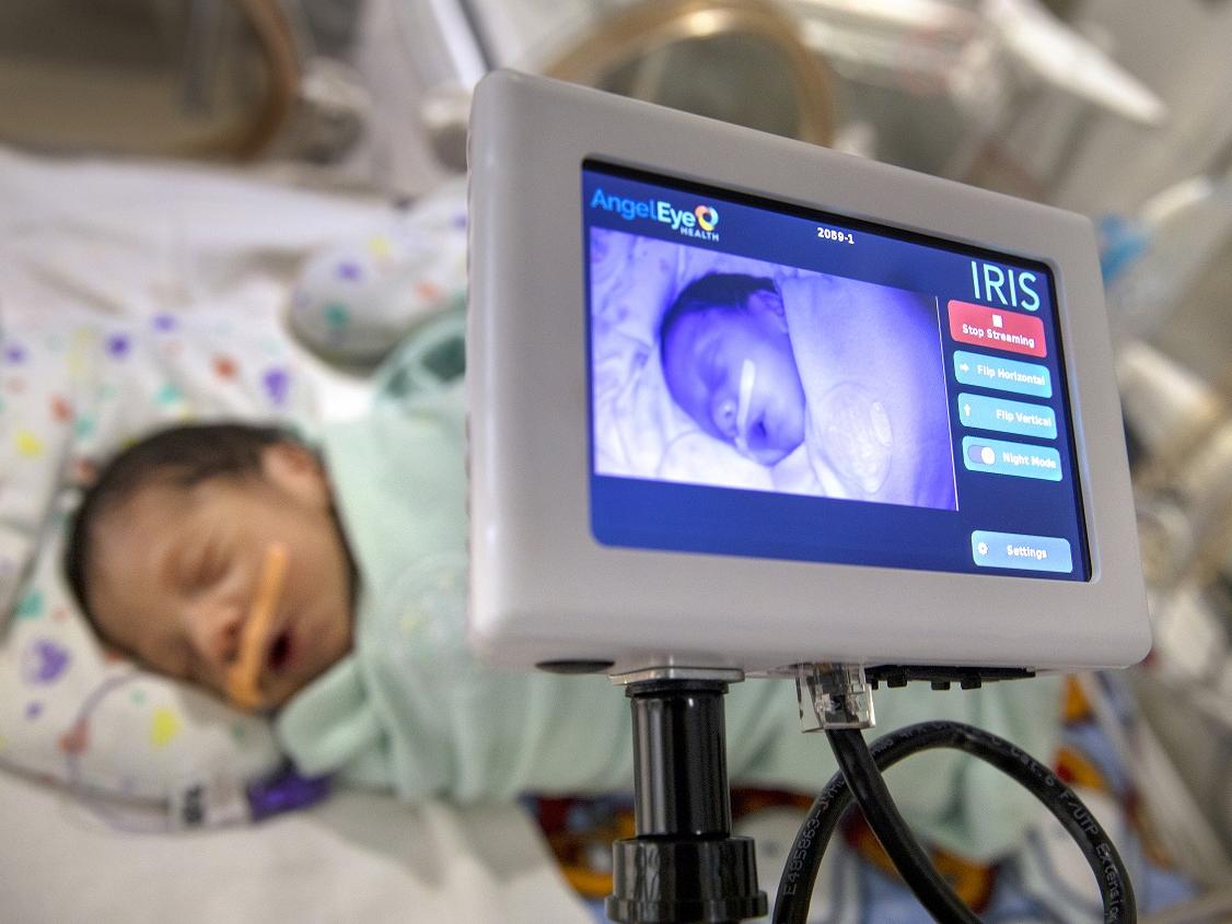 A baby is shown on the monitor of an electronic device.