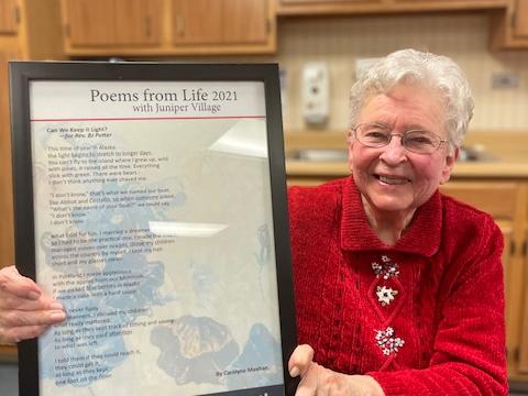 Rev. BJ Potter holding her poem 