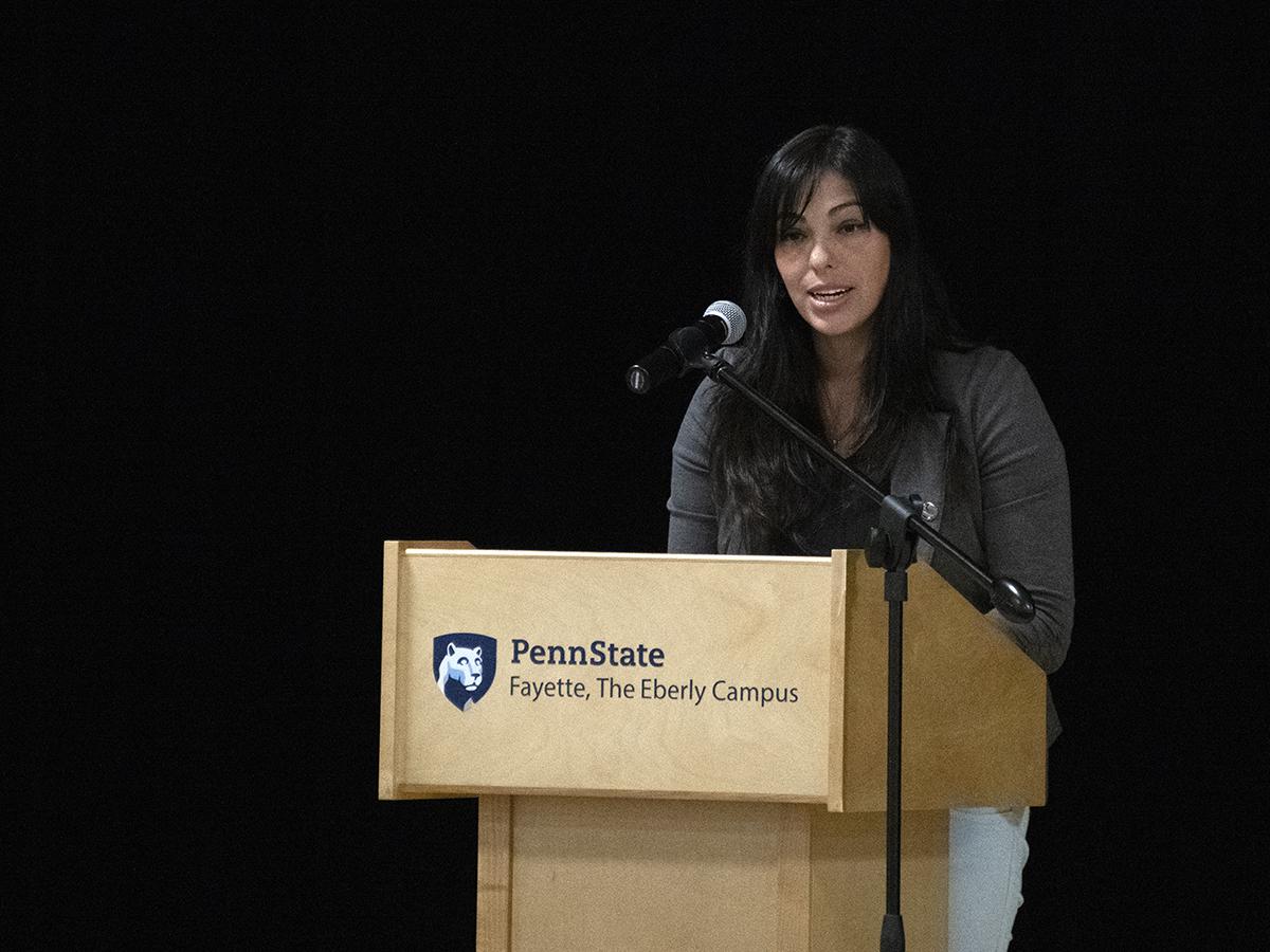 Ginett Pineda inducts forty students into Pi Sigma Phi