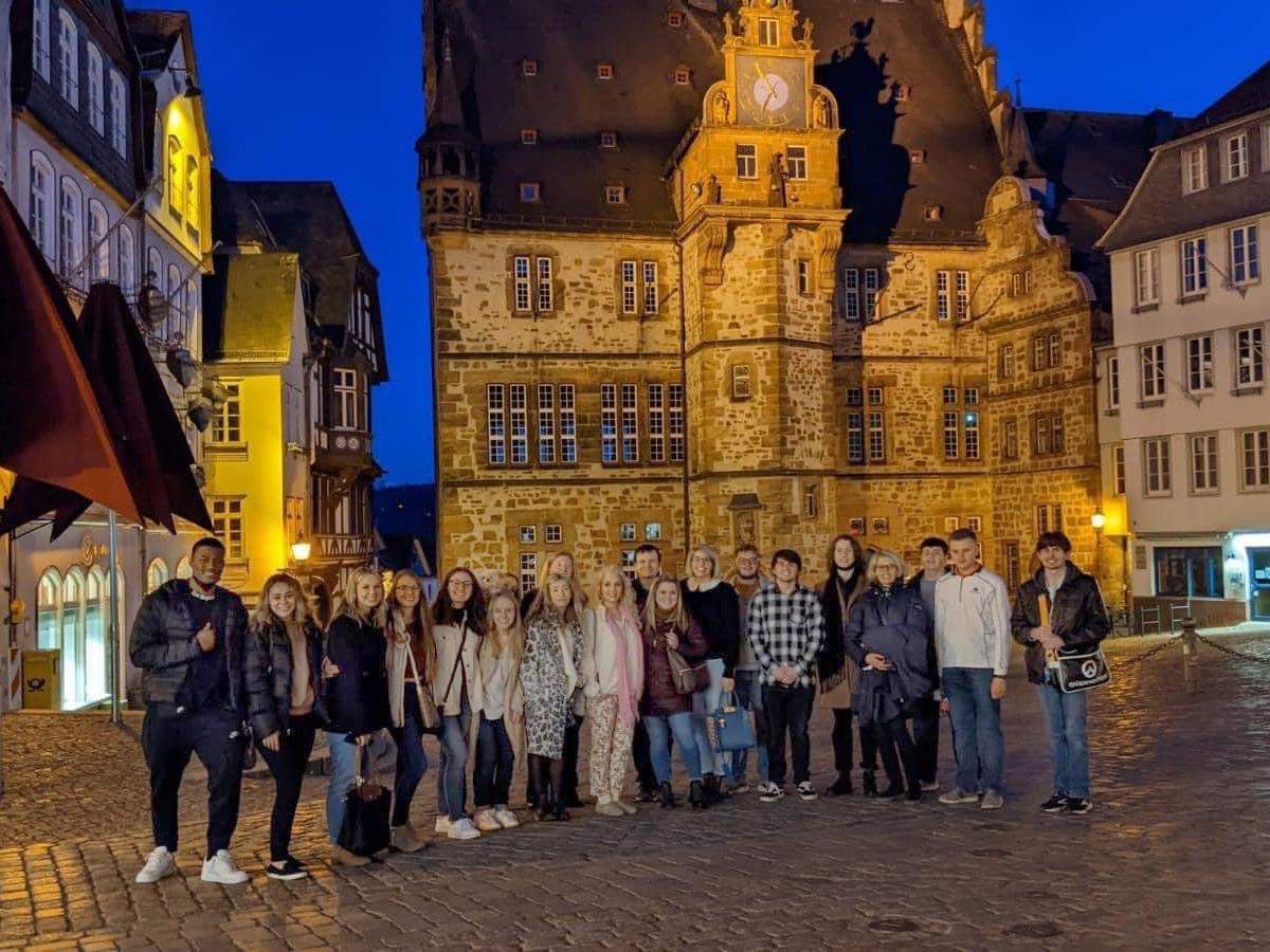 An image of Penn State Schuylkill Students posing on the cobblestone streets of historic German town.