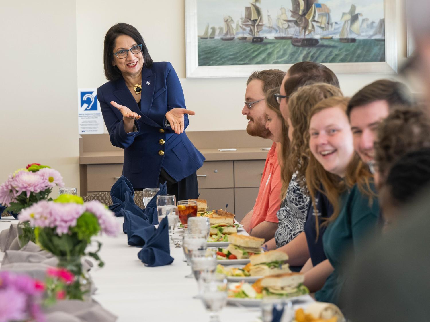 Penn State President-elect Neeli Bendapudi gestures while talking with student leaders at Penn State Behrend.