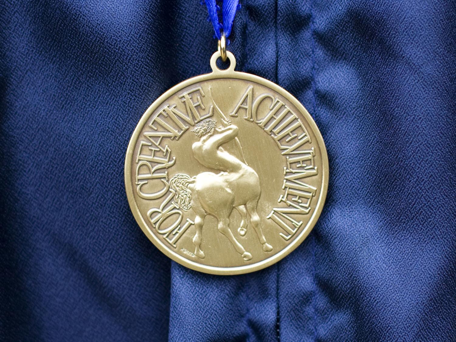 Gold medal on blue background