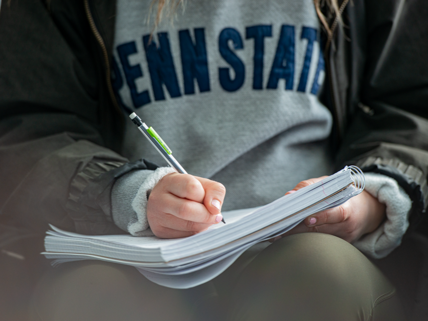 Student taking notes
