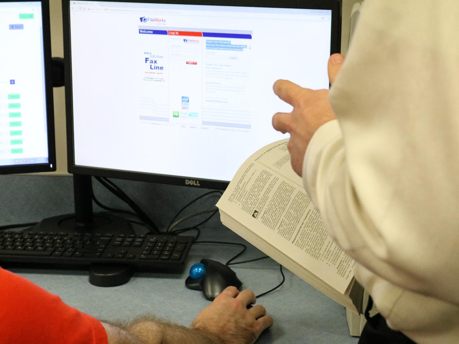 A person helps another person to file their tax return