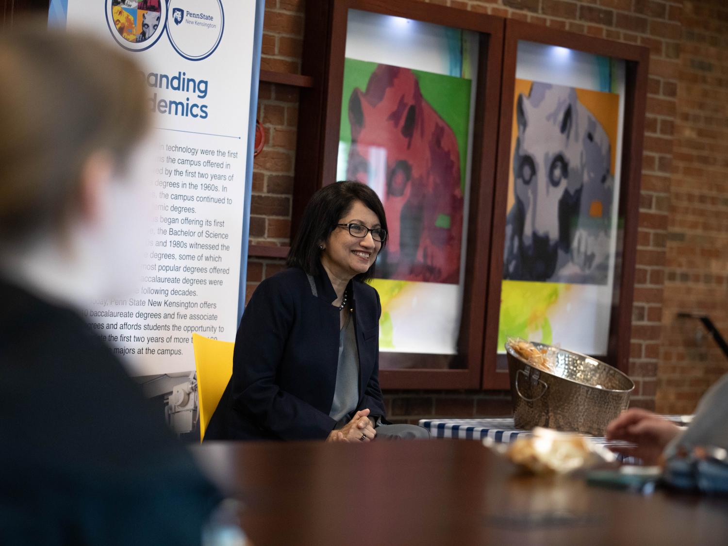 President-elect Neeli Bendapudi smiles with students
