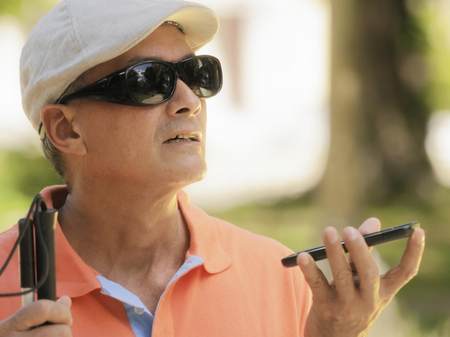 A visually-impaired man uses remote sighted assistance technology.