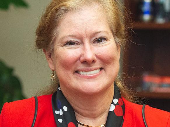 Renata Engel poses in a red blazer