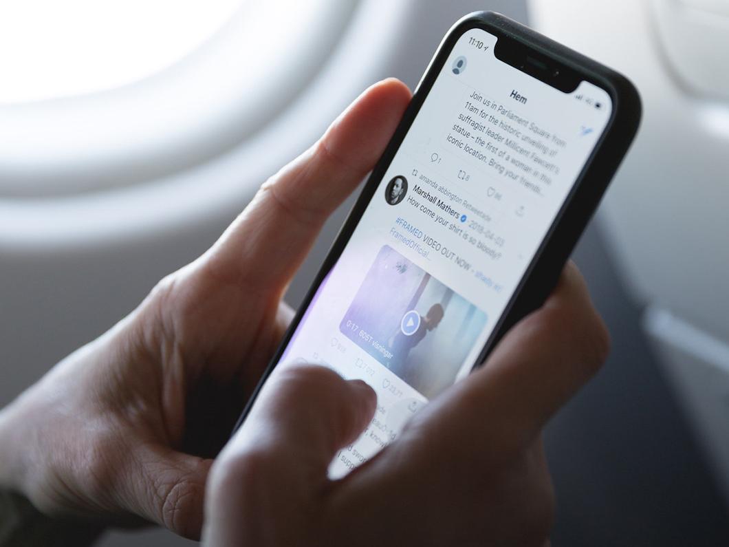 phone showing social media feed