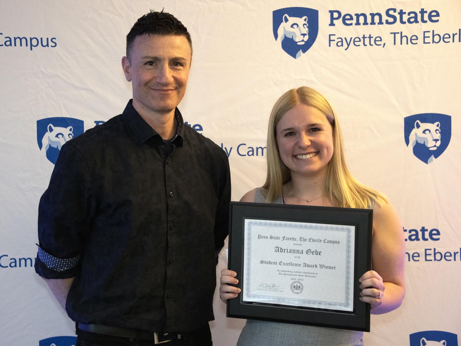Aris Karagiorgakis, assistant teaching professor in psychology, with mentee Adriana Gebe, winner of the 2022 Student Excellence Award.