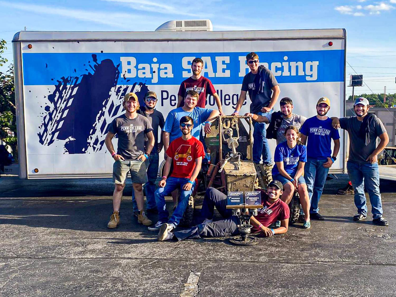 team of students with a first-place trophy