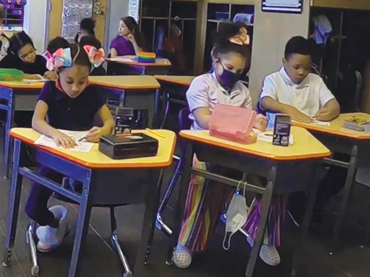 Elementary students sitting at desks in a classroom