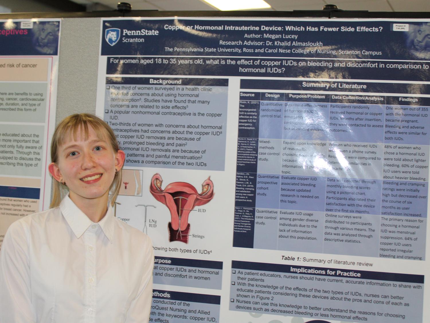 Nursing major Megan Lucey posing in front of her research poster at this year's Penn State Scranton research fair