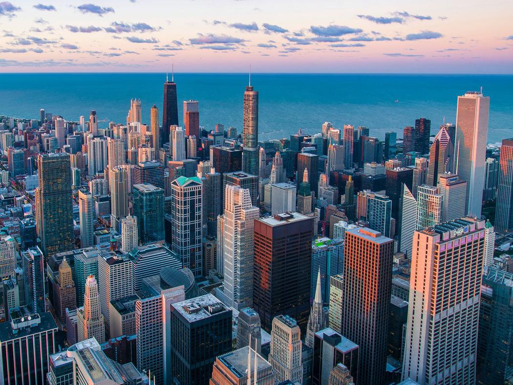 The skyline of Chicago shown at dusk. 