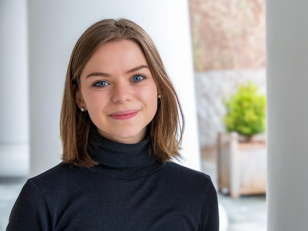 head shot of nora van horn wearing a black turtleneck sweater