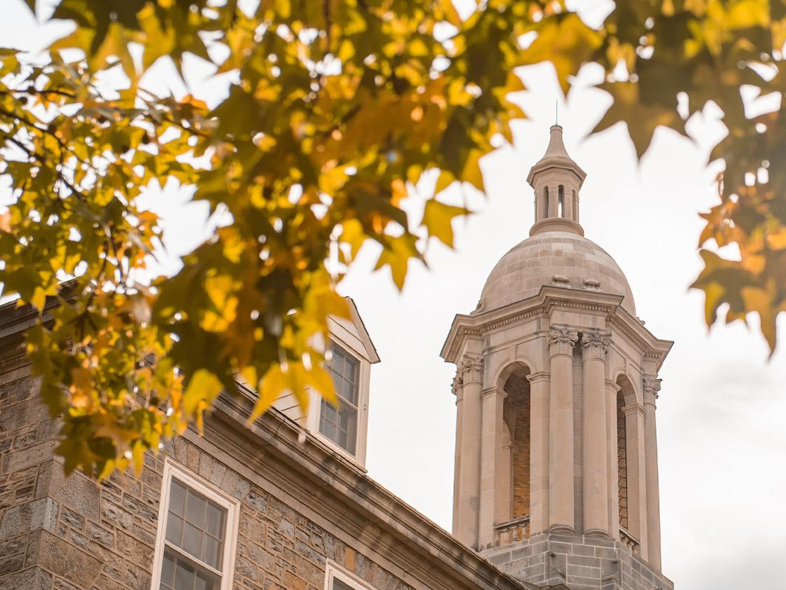 View of Old Main through trees.