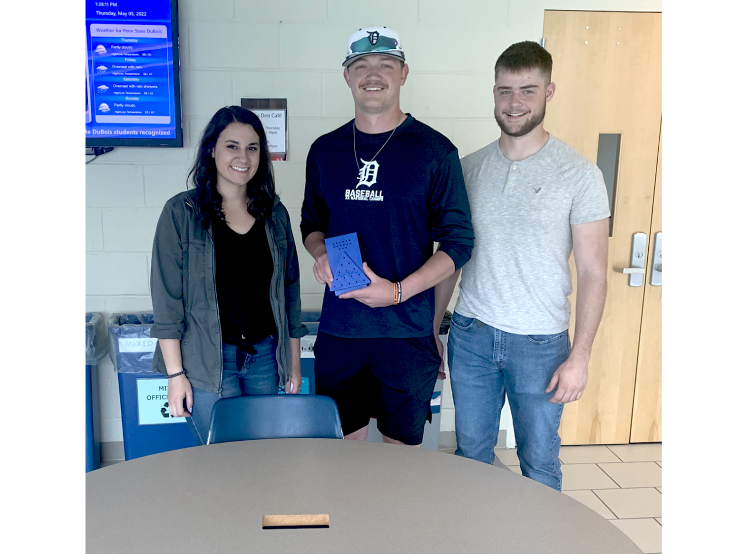 three students show the game they created for a challenge