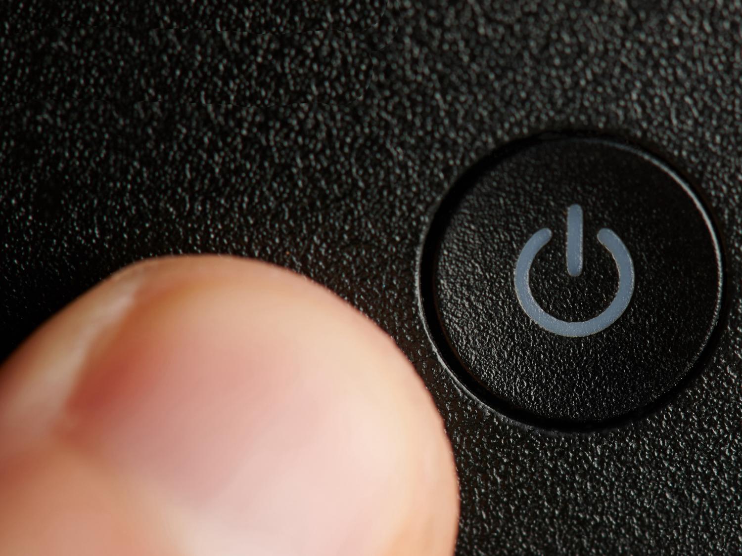 Turning off a power button.
